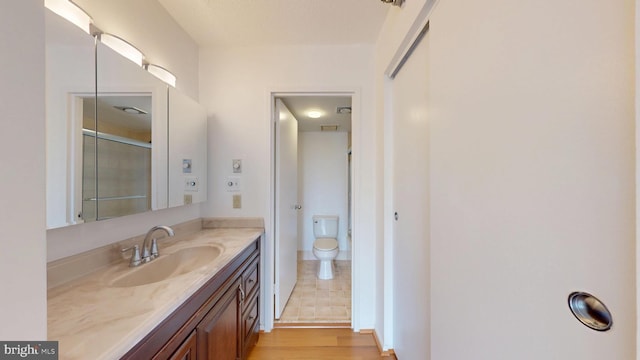 1808 Old Meadow Rd Unit 1015, Mclean, VA 22102 - full bathroom featuring vanity, toilet, and wood finished floors