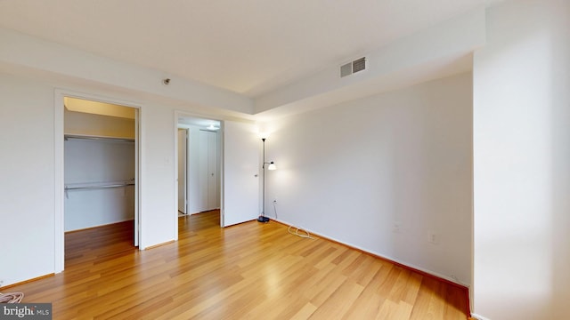 1808 Old Meadow Rd Unit 1015, Mclean, VA 22102 - unfurnished bedroom with light wood-type flooring and a closet