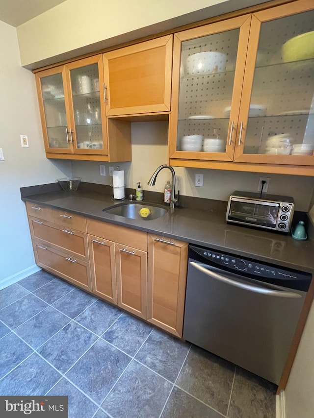 3750 39th St NW Unit C147, Washington, DC 20016 - kitchen with dishwasher, a sink, dark countertops, and glass insert cabinets