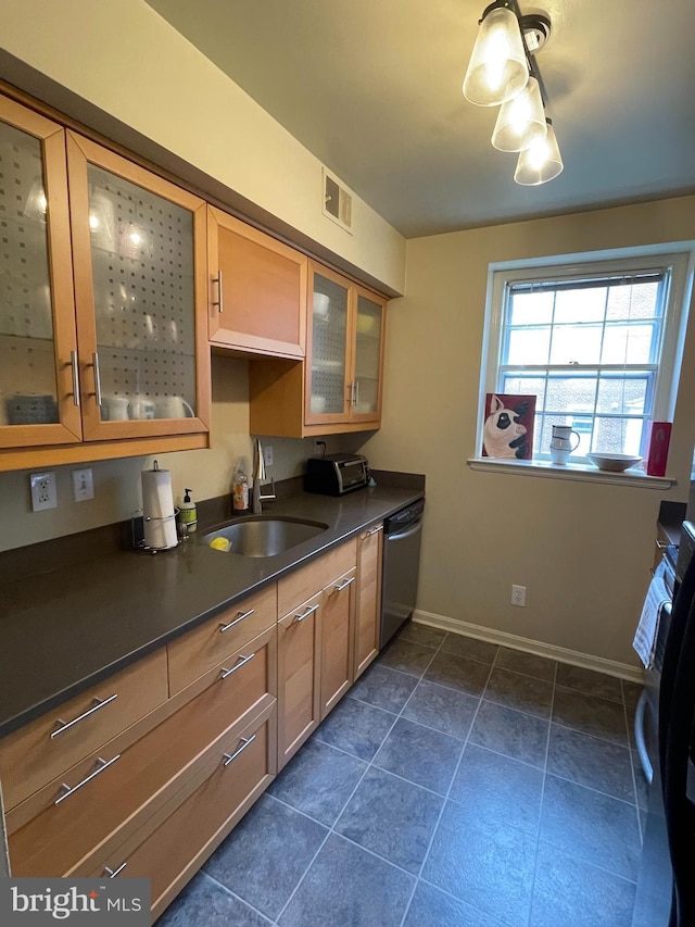 3750 39th St NW Unit C147, Washington, DC 20016 - kitchen with stainless steel dishwasher, a sink, dark countertops, baseboards, and glass insert cabinets