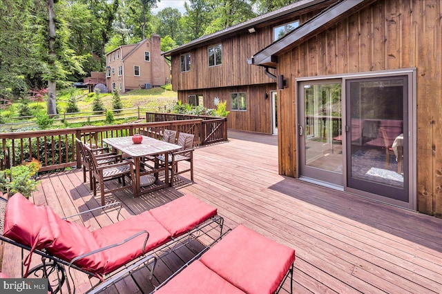 13 Quartz Mill Rd, Newark, DE 19711 - wooden deck featuring outdoor dining area and view of wooded area