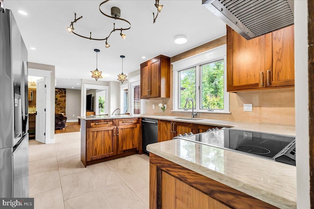13 Quartz Mill Rd, Newark, DE 19711 - kitchen with dishwashing machine, a peninsula, a sink, and brown cabinetry