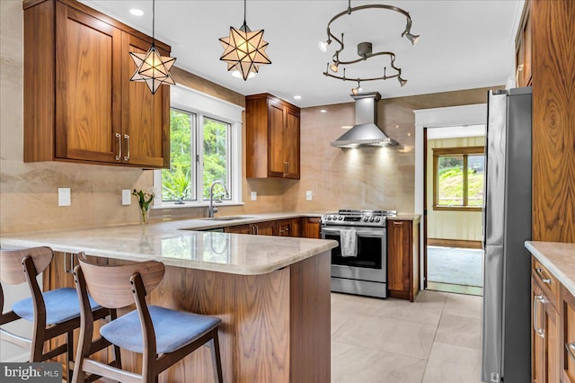 13 Quartz Mill Rd, Newark, DE 19711 - kitchen with stainless steel appliances, wall chimney range hood, a sink, and brown cabinets