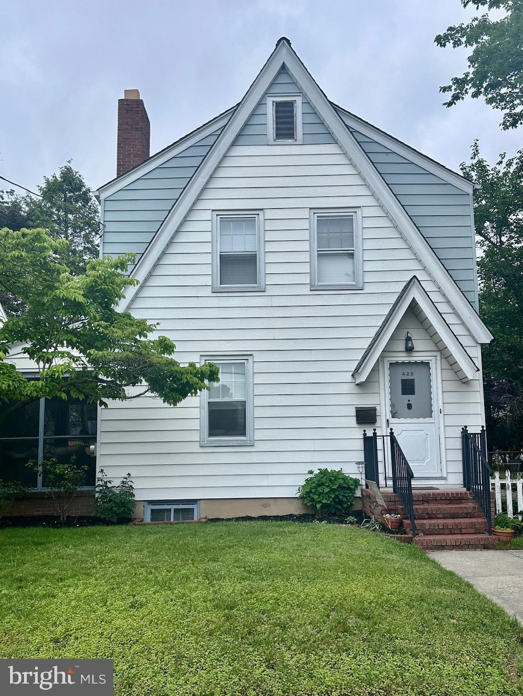 429 Greenway, Ewing, NJ 08618 - view of front facade featuring a chimney, a front lawn, and entry steps