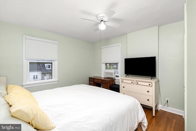 429 Greenway Ave, Ewing, NJ 08618 - bedroom with dark wood finished floors, cooling unit, baseboards, and ceiling fan