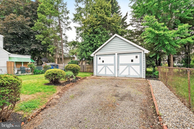 429 Greenway Ave, Ewing, NJ 08618 - detached garage featuring view of wooded area