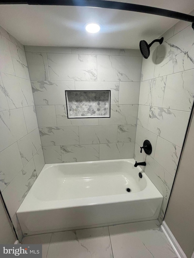 5010 54th Ave, Hyattsville, MD 20781 - bathroom with marble look tile flooring and bathing tub / shower combination