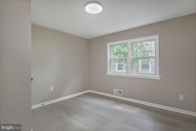 5010 54th Ave, Hyattsville, MD 20781 - spare room featuring wood finished floors and baseboards