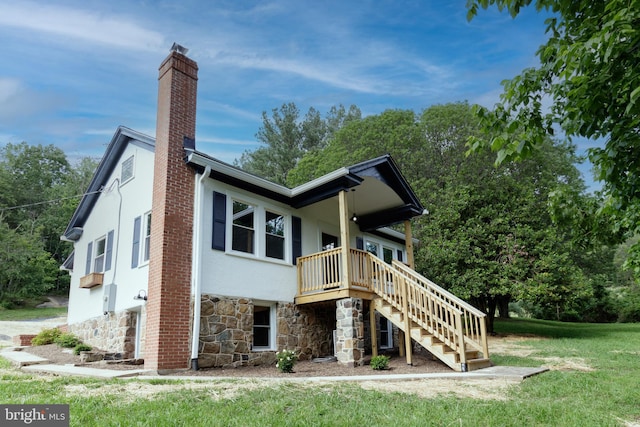 30 Gooney Falls Ln, Front Royal, VA 22630 - rear view of house with stone siding, a chimney, stairway, stucco siding, and a lawn