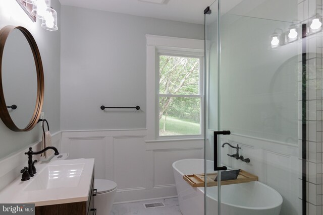 30 Gooney Falls Ln, Front Royal, VA 22630 - full bathroom with a decorative wall, vanity, a wainscoted wall, a freestanding tub, and a stall shower
