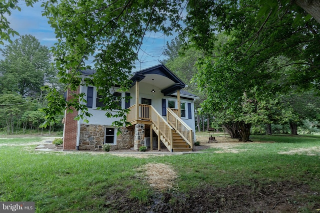 30 Gooney Falls Ln, Front Royal, VA 22630 - view of front of home featuring stone siding, stairway, a front yard, and stucco siding