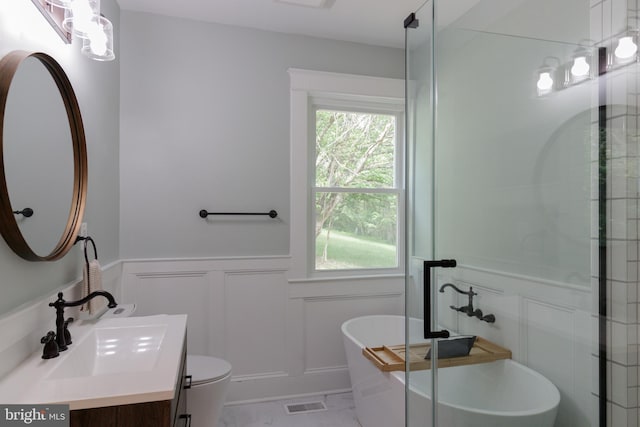 30 Gooney Falls Ln, Front Royal, VA 22630 - bathroom with a decorative wall, vanity, a wainscoted wall, a freestanding tub, and a shower stall