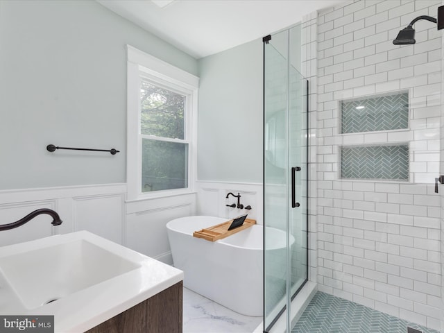 30 Gooney Falls Ln, Front Royal, VA 22630 - bathroom with marble finish floors, a stall shower, a freestanding bath, a wainscoted wall, and a decorative wall