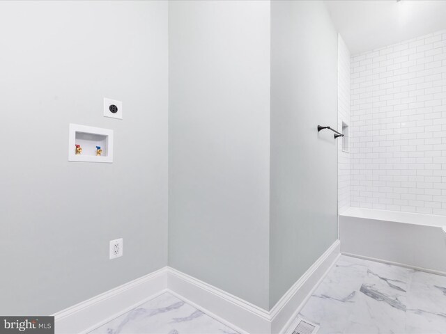 30 Gooney Falls Ln, Front Royal, VA 22630 - laundry area featuring marble look tile flooring, hookup for an electric dryer, washer hookup, and baseboards