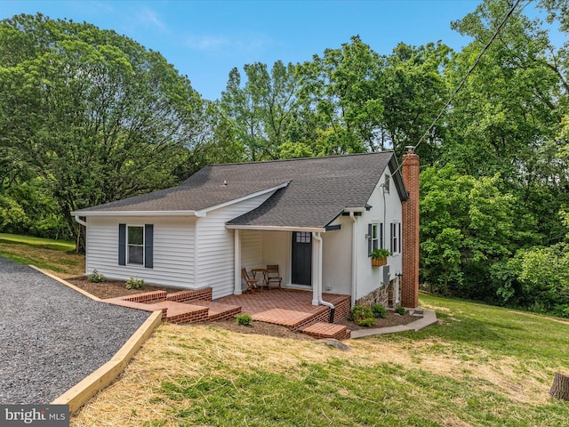 30 Gooney Falls Ln, Front Royal, VA 22630 - rear view of property featuring a chimney, a yard, and a shingled roof