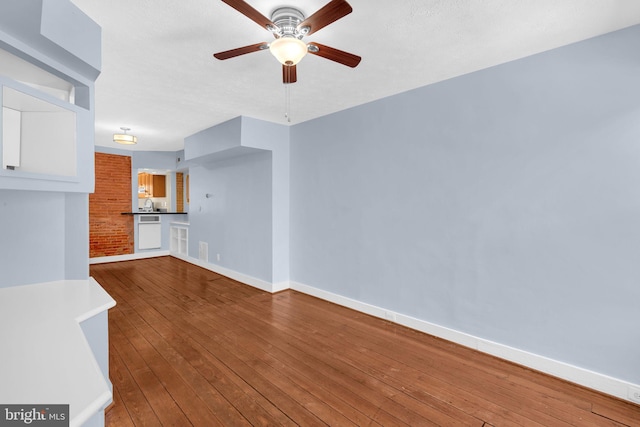 109 E Clement St, Baltimore, MD 21230 - unfurnished living room with a ceiling fan and wood-type flooring