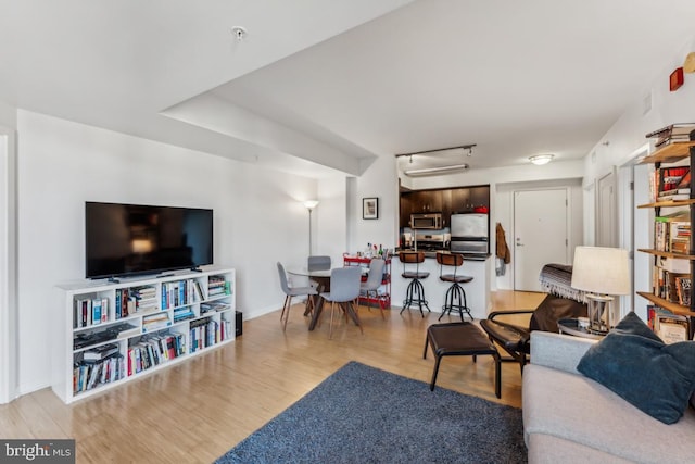 440 L St NW Unit 901, Washington, DC 20001 - living room with wood finished floors, attic access, and baseboards