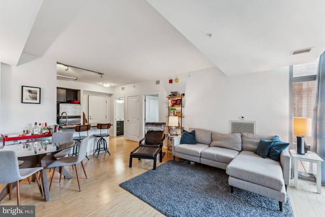 440 L St NW Unit 901, Washington, DC 20001 - living area with light wood finished floors and rail lighting