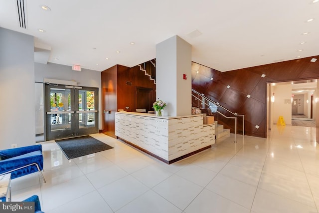 440 L St NW Unit 901, Washington, DC 20001 - reception area with wooden walls, stairway, french doors, and recessed lighting