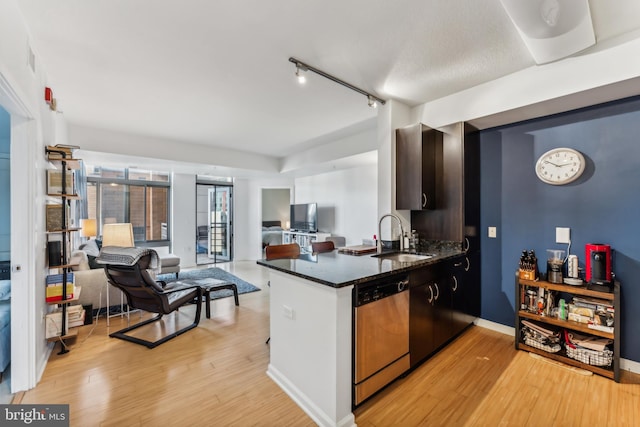 440 L St NW Unit 901, Washington, DC 20001 - kitchen featuring dishwasher, a sink, open floor plan, and light wood finished floors