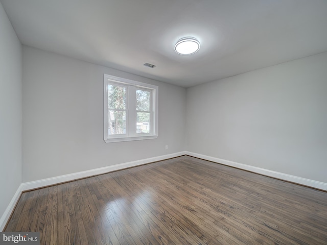 401 Bryan Point Rd, Accokeek, MD 20607 - empty room featuring baseboards and dark wood-style flooring