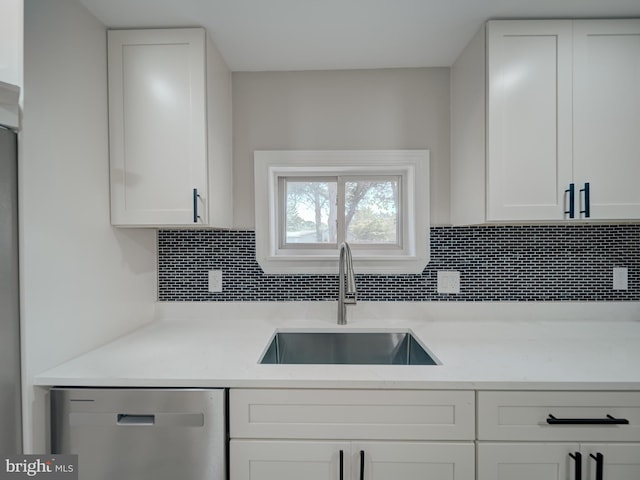 401 Bryan Point Rd, Accokeek, MD 20607 - kitchen featuring stainless steel dishwasher, decorative backsplash, and white cabinets