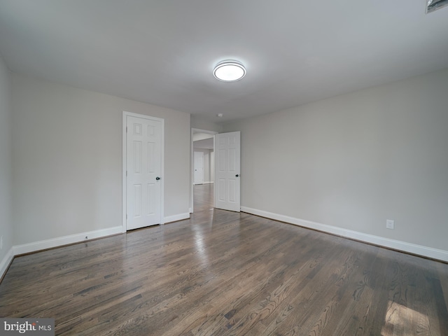 401 Bryan Point Rd, Accokeek, MD 20607 - unfurnished room with baseboards and dark wood-type flooring