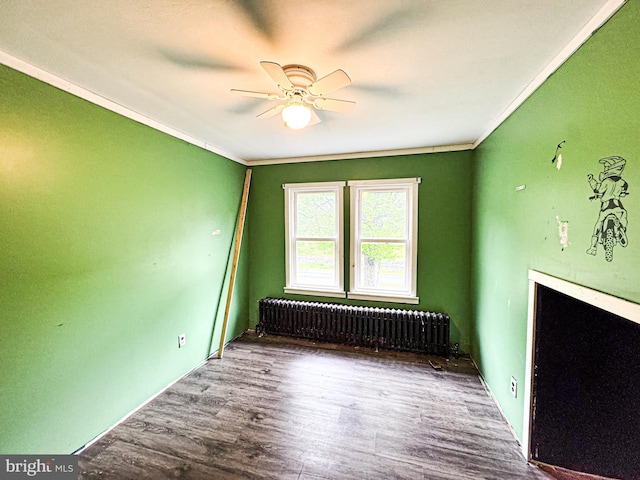 3709 US Highway 522 N, Lewistown, PA 17044 - spare room with radiator heating unit, ornamental molding, a ceiling fan, and wood finished floors