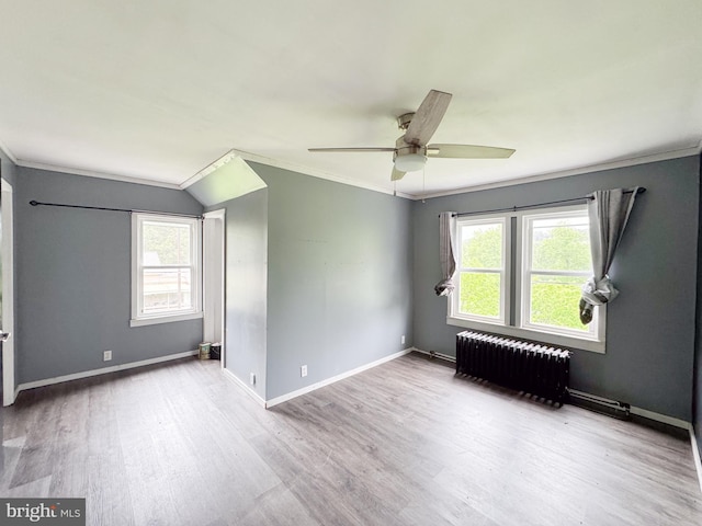 3709 US Highway 522 N, Lewistown, PA 17044 - spare room with radiator heating unit, wood finished floors, ceiling fan, crown molding, and baseboards