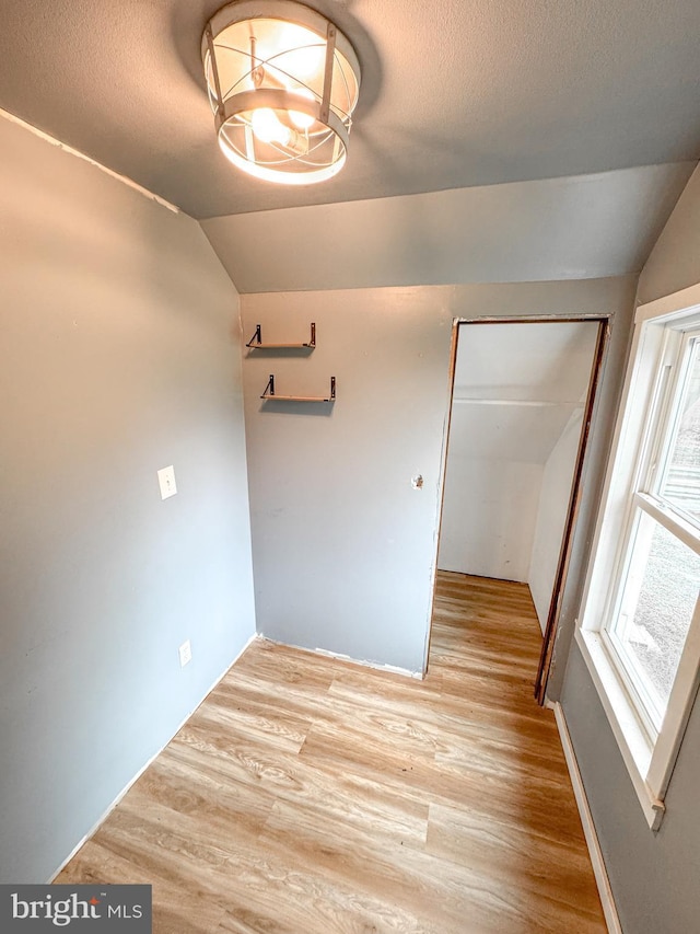 3709 US Highway 522 N, Lewistown, PA 17044 - empty room featuring vaulted ceiling, light wood-style floors, and a textured ceiling