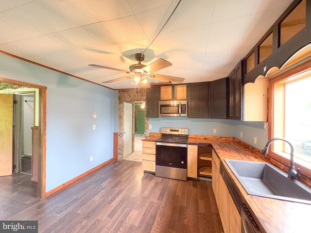 3709 US Highway 522 N, Lewistown, PA 17044 - kitchen with appliances with stainless steel finishes, a sink, dark wood-style floors, a ceiling fan, and baseboards
