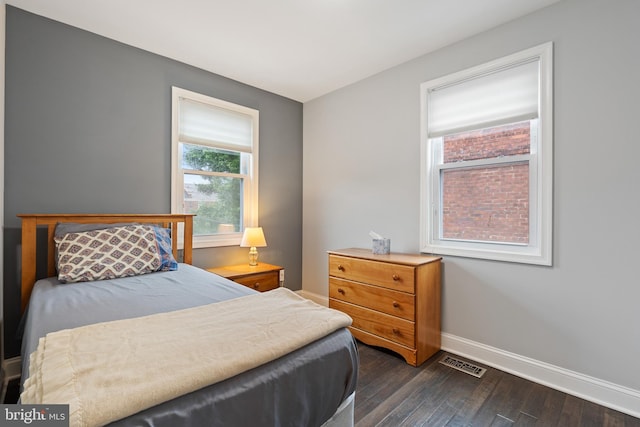 5054 8th St NE, Washington, DC 20017 - bedroom with baseboards and dark wood-type flooring