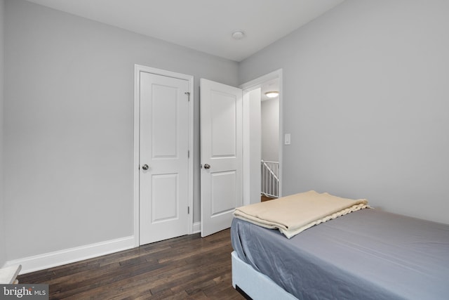 5054 8th St NE, Washington, DC 20017 - bedroom with dark wood-style flooring and baseboards