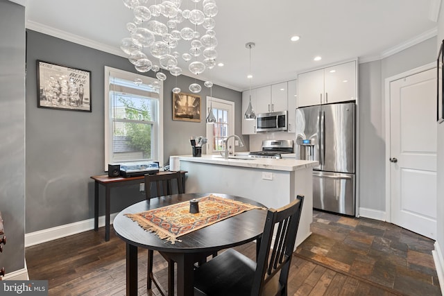 5054 8th St NE, Washington, DC 20017 - dining area featuring crown molding, a chandelier, baseboards, recessed lighting, and dark wood finished floors