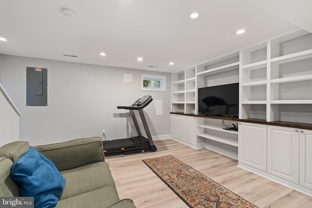 5054 8th St NE, Washington, DC 20017 - workout area featuring electric panel, light wood-style flooring, baseboards, recessed lighting, and built in features