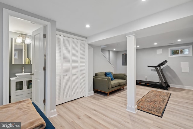 5054 8th St NE, Washington, DC 20017 - workout room featuring wood finished floors, electric panel, a sink, baseboards, and recessed lighting