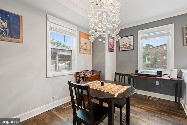 5054 8th St NE, Washington, DC 20017 - dining area with a chandelier, crown molding, wood-type flooring, plenty of natural light, and baseboards