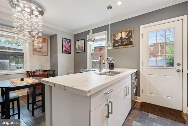 5054 8th St NE, Washington, DC 20017 - kitchen with a sink, a chandelier, healthy amount of natural light, ornamental molding, and white cabinets