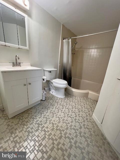 3354 Huntley Square Dr Unit T2, Temple Hills, MD 20748 - full bathroom featuring toilet, vanity, shower / tub combo with curtain, and brick patterned floors