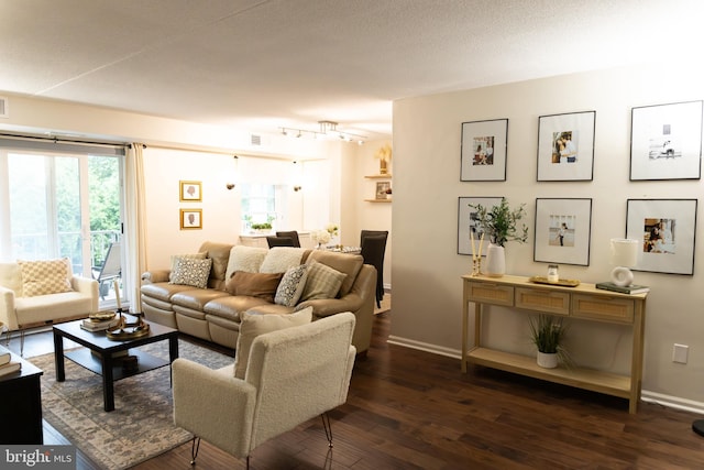 919 W Montgomery Ave Unit 1-5, Bryn Mawr, PA 19010 - living area featuring baseboards and dark wood-style floors