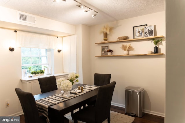 919 W Montgomery Ave Unit 1-5, Bryn Mawr, PA 19010 - dining room featuring a textured ceiling, wood finished floors, baseboards, and track lighting
