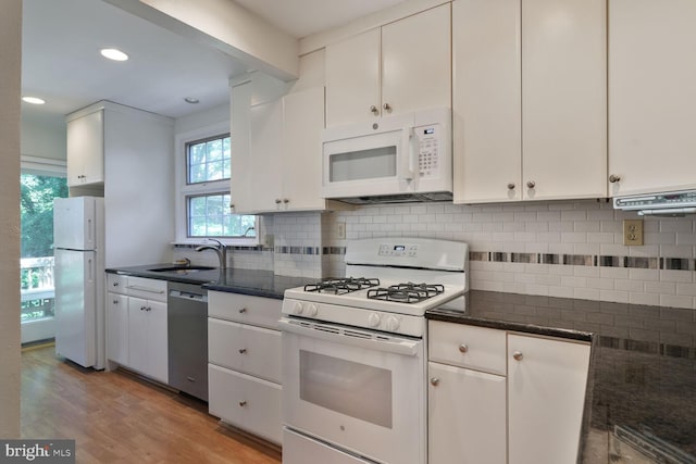 5811 Augusta Ln, Bethesda, MD 20816 - kitchen featuring white appliances, a sink, white cabinetry, light wood finished floors, and backsplash