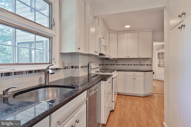 5811 Augusta Ln, Bethesda, MD 20816 - kitchen featuring white appliances, a sink, tasteful backsplash, white cabinetry, and crown molding
