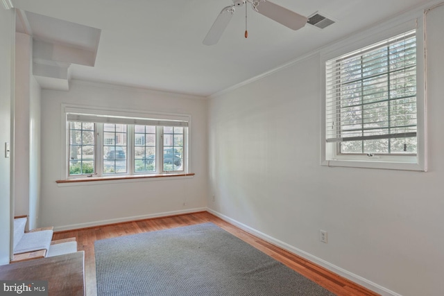 5811 Augusta Ln, Bethesda, MD 20816 - unfurnished room with wood finished floors, ornamental molding, ceiling fan, baseboards, and stairway