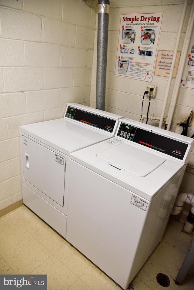 4360 Ivymount Ct Unit 32, Annandale, VA 22003 - community laundry room featuring washer and dryer, concrete block wall, and light floors
