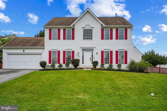 5987 Calvert, Eldersburg, MD 21784 - colonial-style house featuring driveway, a garage, and roof with shingles