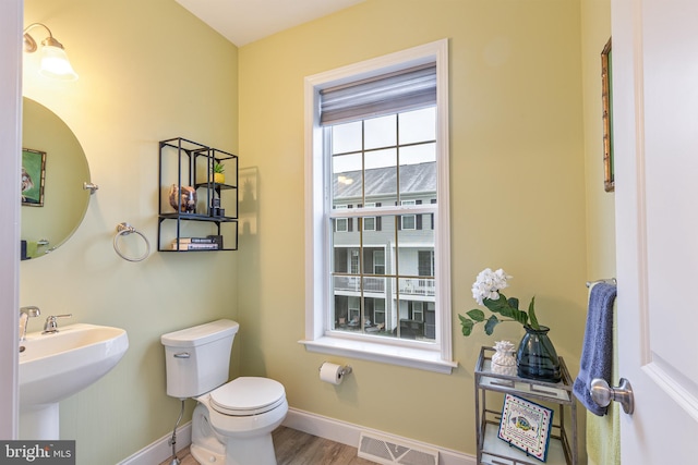 3226 Light Way, Mechanicsburg, PA 17055 - bathroom with baseboards, toilet, and wood finished floors