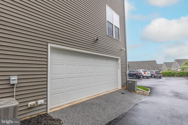 3226 Light Way, Mechanicsburg, PA 17055 - garage featuring central AC unit and driveway