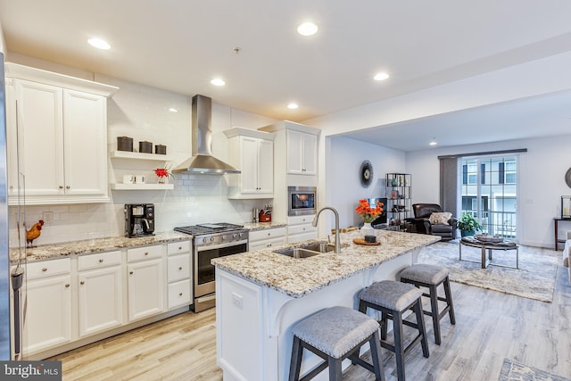 3226 Light Way, Mechanicsburg, PA 17055 - kitchen with a sink, wall chimney range hood, appliances with stainless steel finishes, light wood-style floors, and open floor plan