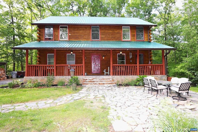 5254 Havenwood Ln, Schuyler, VA 22969 - view of front of house with log siding, covered porch, and metal roof